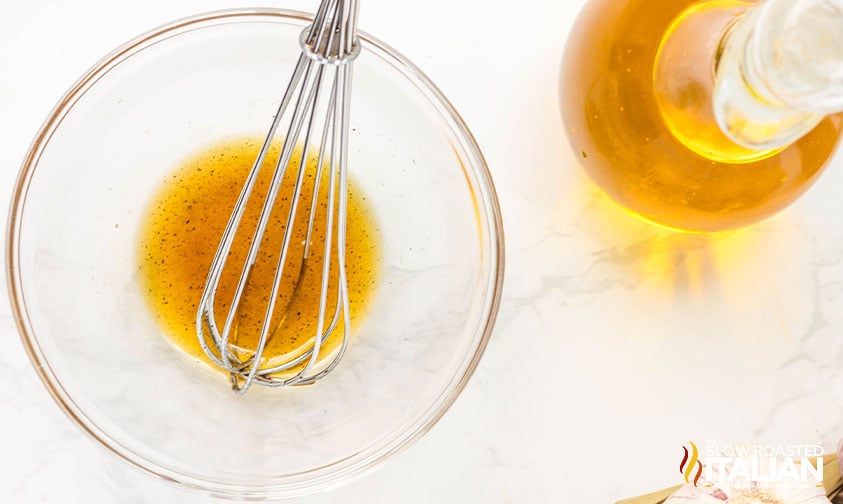 olive oil, maple syrup, salt and pepper whisked in a bowl