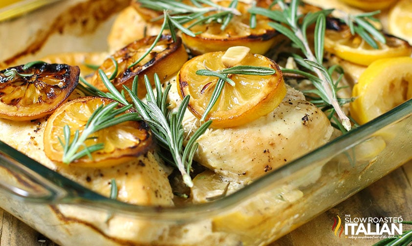 baked lemon rosemary chicken breasts in baking dish