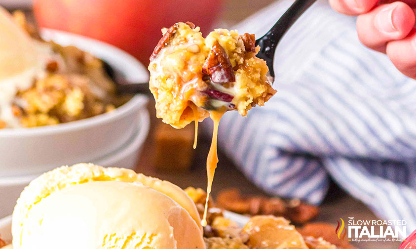 closeup of caramel apple dump cake on a fork