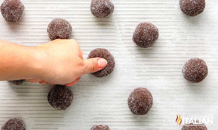 making a thumbprint in chocolate cookie dough