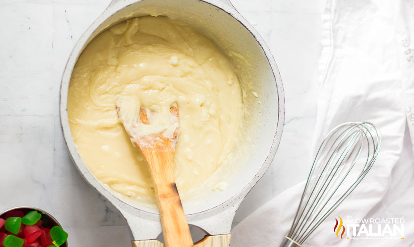 melted white chocolate chips and sweetened condensed milk in a pot