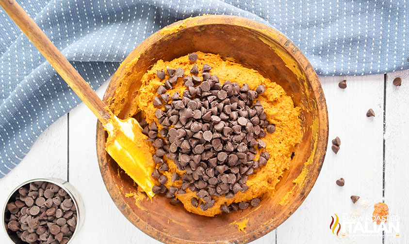 adding chocolate chips to pumpkin bread ingredients