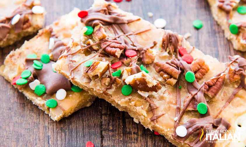 salted caramel toffee bars laying on a wood board