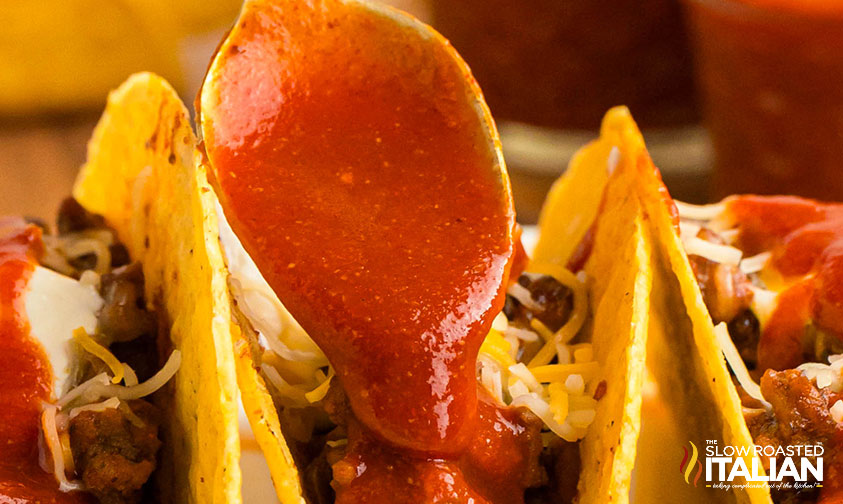 closeup of taco bell sauce spooned onto a taco