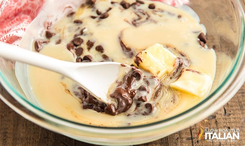 stirring melted condensed milk, butter, and chocolate chips together