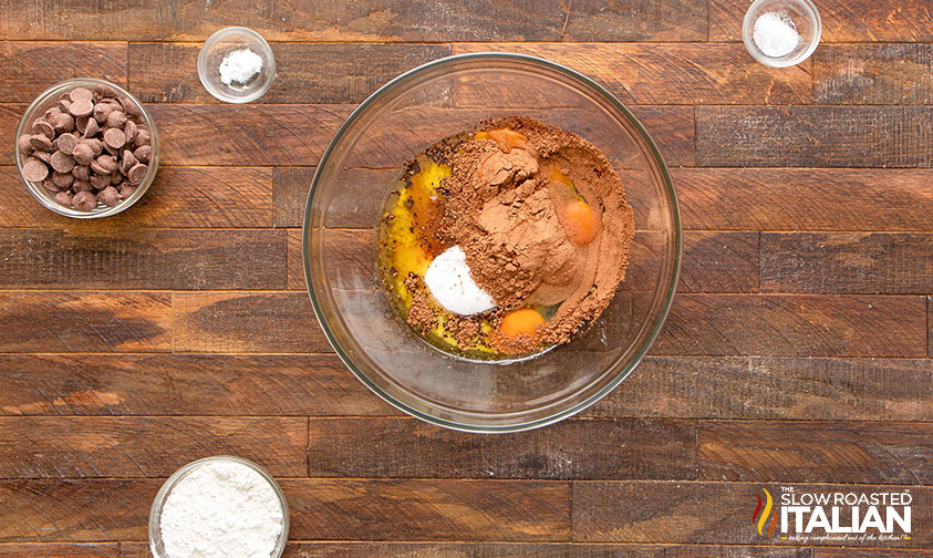 melted butter, eggs, cocoa, sugar and vanilla in a glass mixing bowl