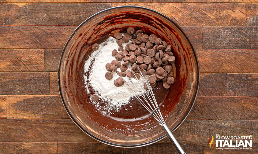 adding flour and chocolate chips to mixing bowl.