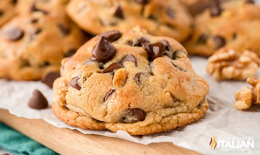 gooey chocolate chip cookies on wooden board