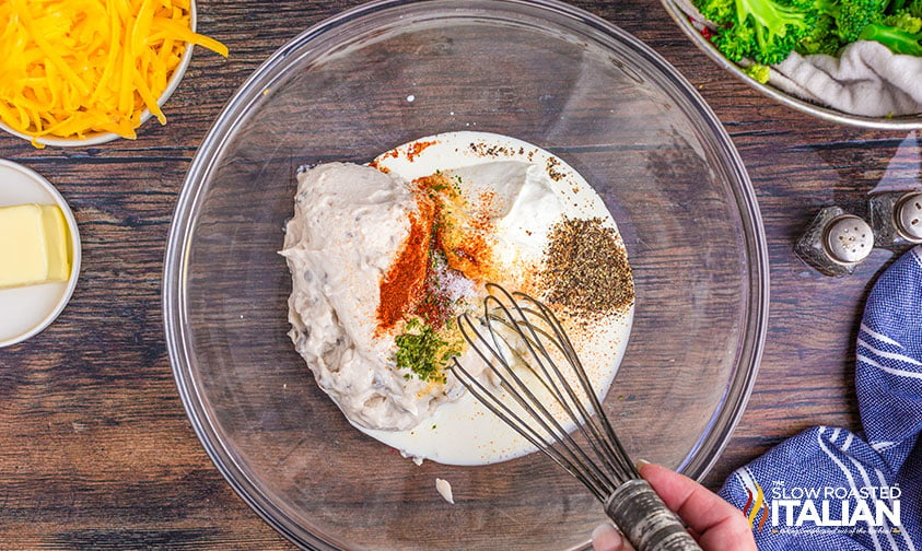 sour cream, soup, and spices in a mixing bowl