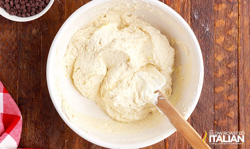 folding freshly whipped cream into ricotta mixture for cannoli filling