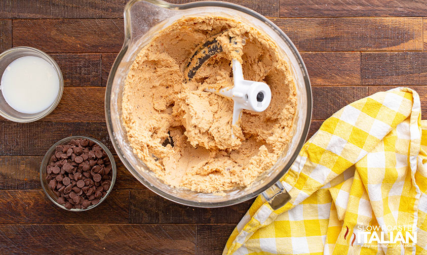 making butterfinger frosting for loaded brownies