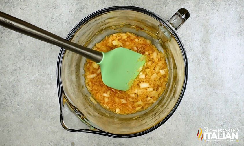 mixed rice, seasoning and onions in mixing bowl