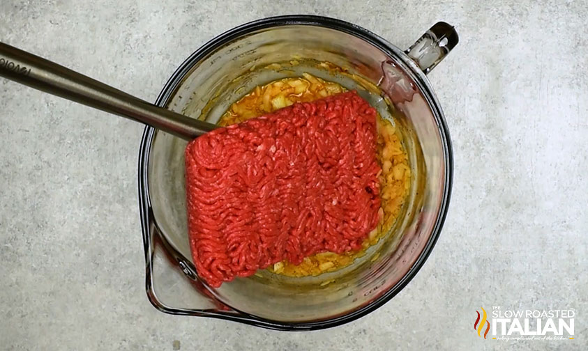 adding ground beef to rice mixture