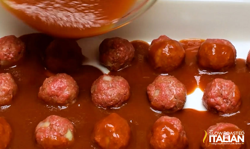 adding sauce to porcupine meatballs