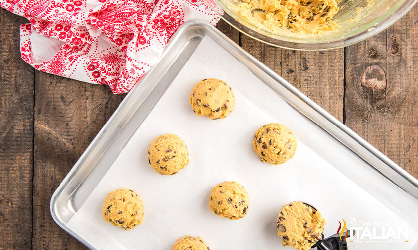 scooping cookie dough onto baking sheet