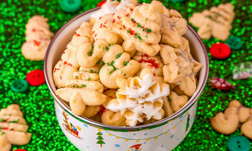 spritz cookies in a Christmas tin