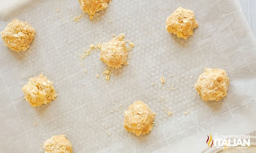 apple cookie dough balls on parchment lined pan
