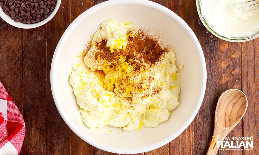 ricotta, vanilla, cinnamon, and lemon zest in bowl to make cannoli filling