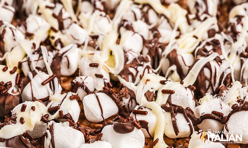 close up: chocolate drizzles krispie treats with marshmallows