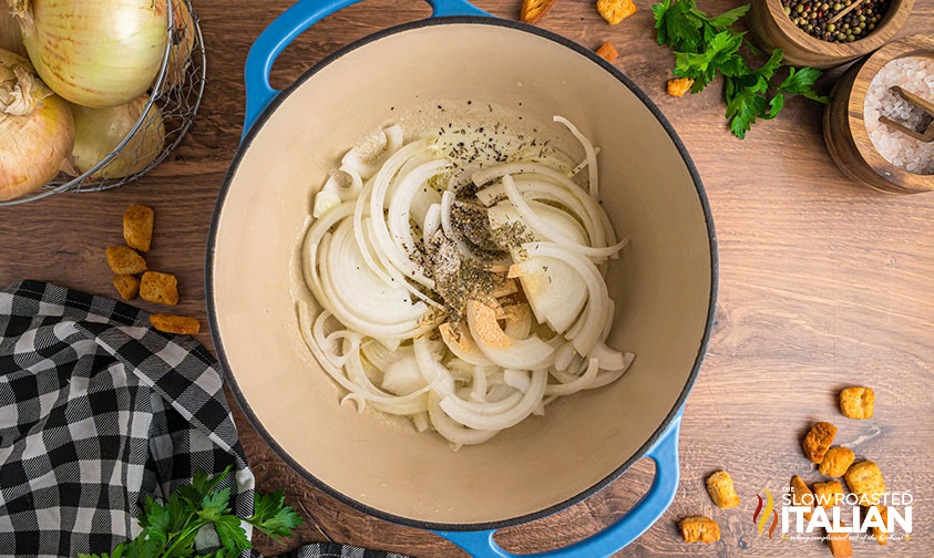 onions and seasoning in a dutch oven