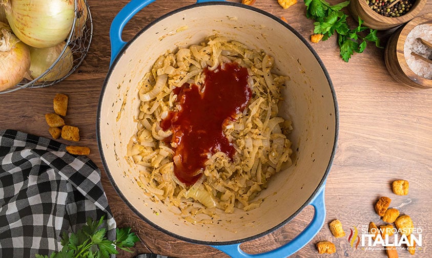 cooked onions with tomato soup in a heavy pot