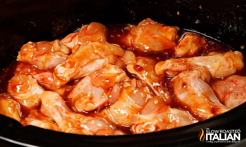 chicken wings smothered in sauce in crock pot