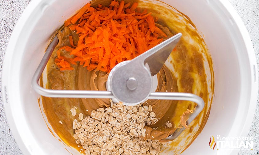overhead: peanut butter, oats, and shredded carrot in stand mixer