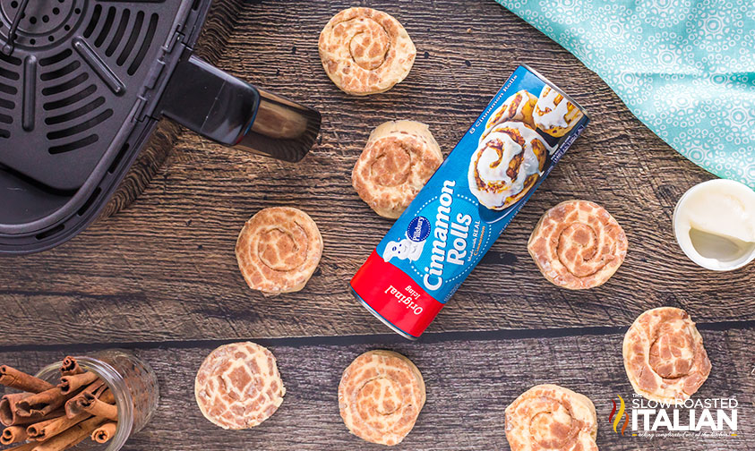 can of pillsbury cinnamon rolls surrounded by separated rolls