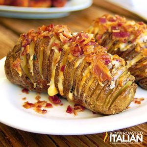 crispy bacon cheddar hasselback potatoes on a plate