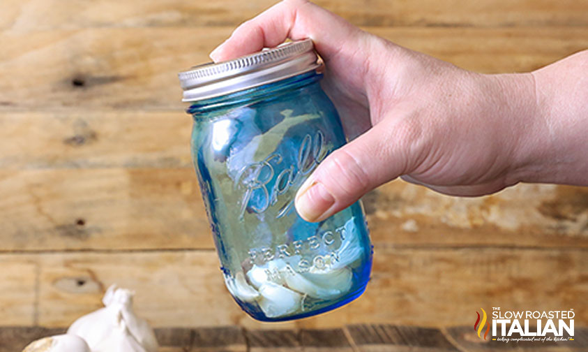 garlic placed in jar to be peeled