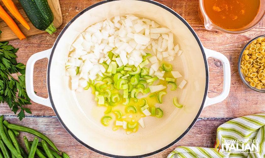 cooking onion and celery in a large pot