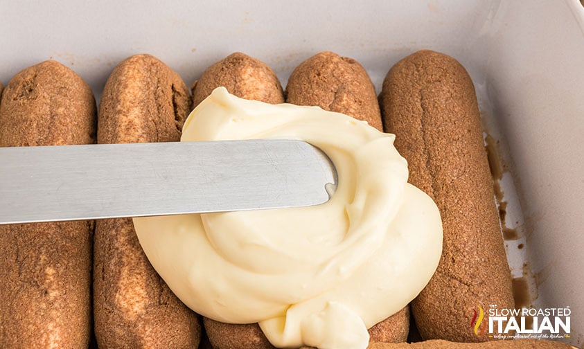 spreading filling over ladyfinger cookies