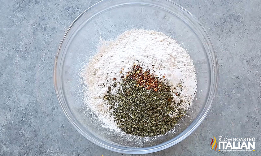 ingredients for pepperoni pizza bites in mixing bowl