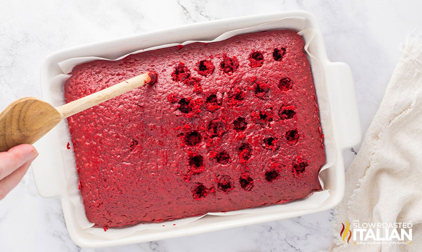 poking holes in baked red velvet cake