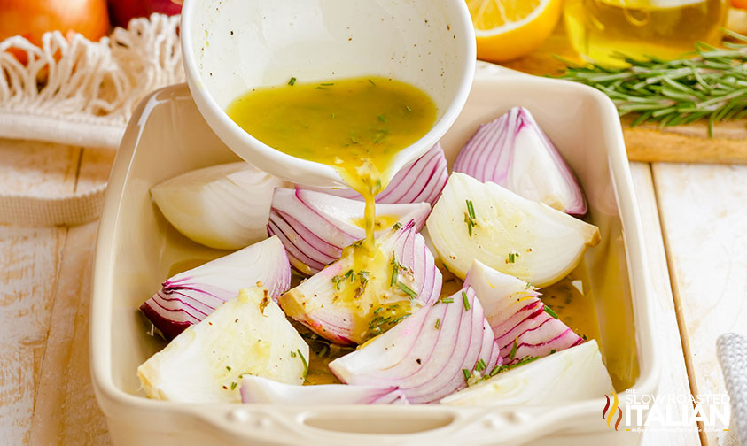 pouring dressing over sliced onions