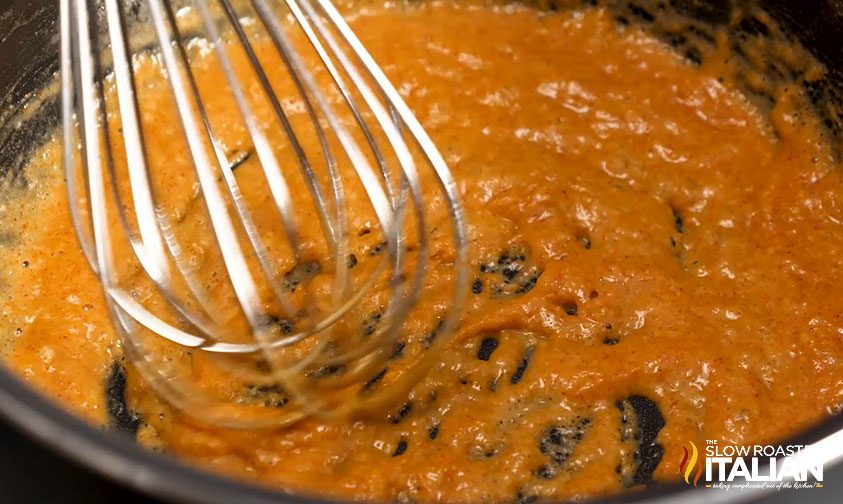 whisking roux seasoned with cayenne