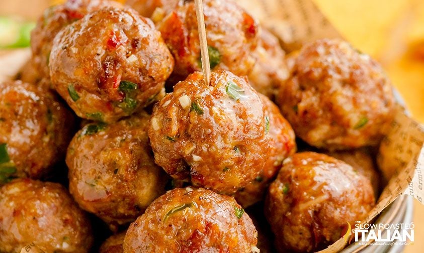 closeup: jalapeno bacon meatballs with toothpicks in a bowl