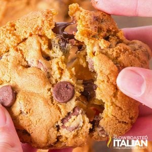 hand pulling apart an air fryer chocolate chip cookie