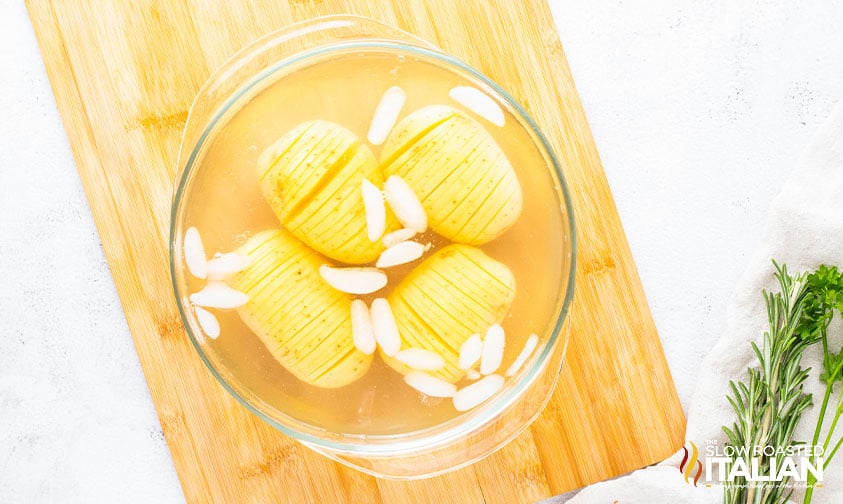 sliced potatoes in a glass bowl