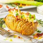 air fryer hasselback potato on a plate with fork