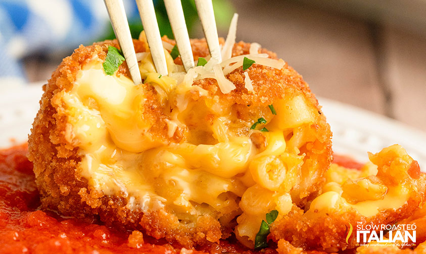 closeup of inside of a cheesecake factory fried mac and cheese bite