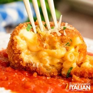 Closeup of inside of a cheesecake factory fried mac and cheese bite