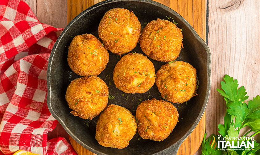 fried crab balls in a cast iron skillet