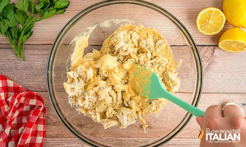 adding crab meat to mixing bowl