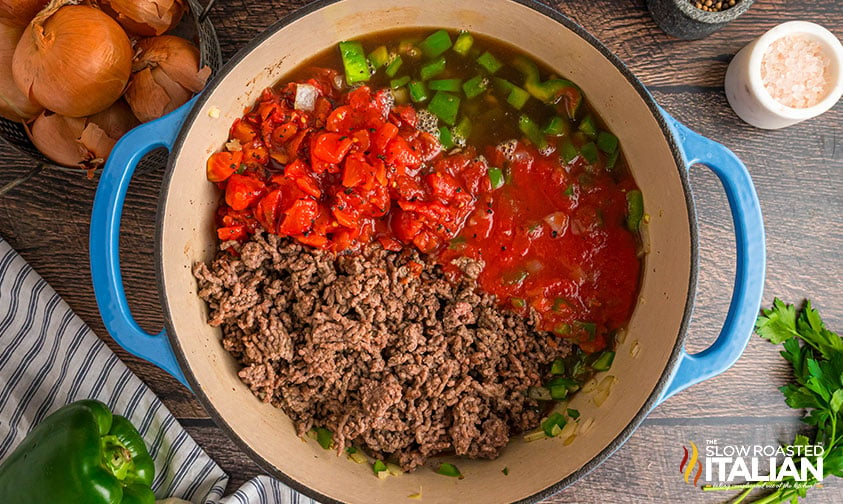 tomatoes and beef stock added to large pot