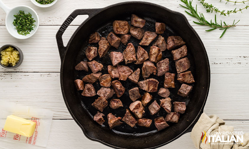 cooked steak bites in skillet