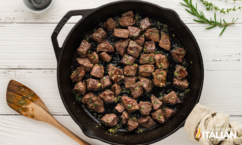 steak bites added to garlic butter mixture