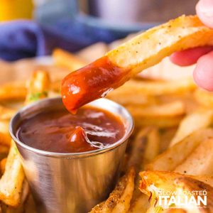 homemade air fryer french fries dipped in ketchup