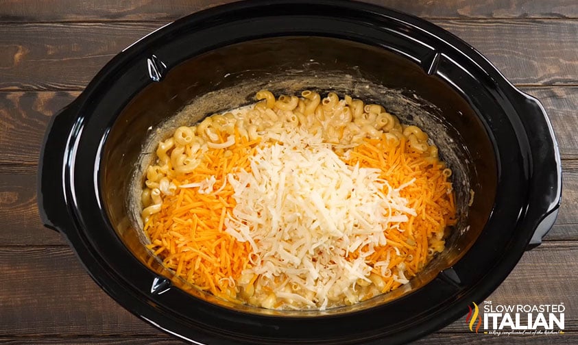 adding shredded cheese to crockpot