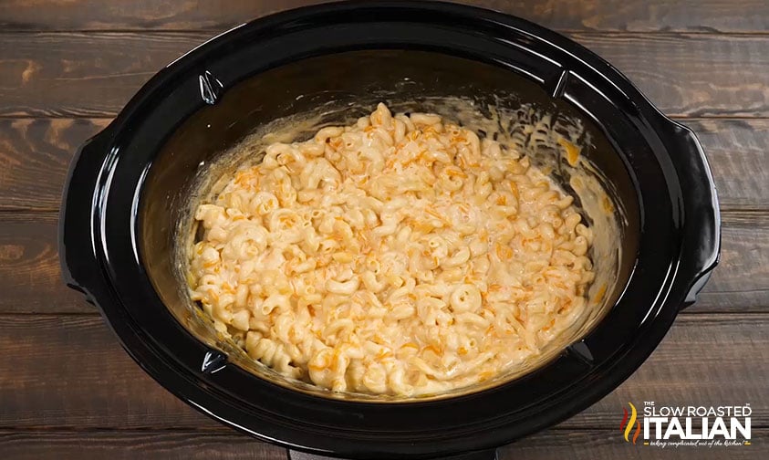 mixed ingredients for mac and cheese in crockpot
